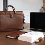Leather bags for men in Germany displayed in a professional lifestyle setting