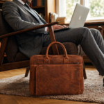 Leather laptop bags in Germany displayed in a professional workspace setting